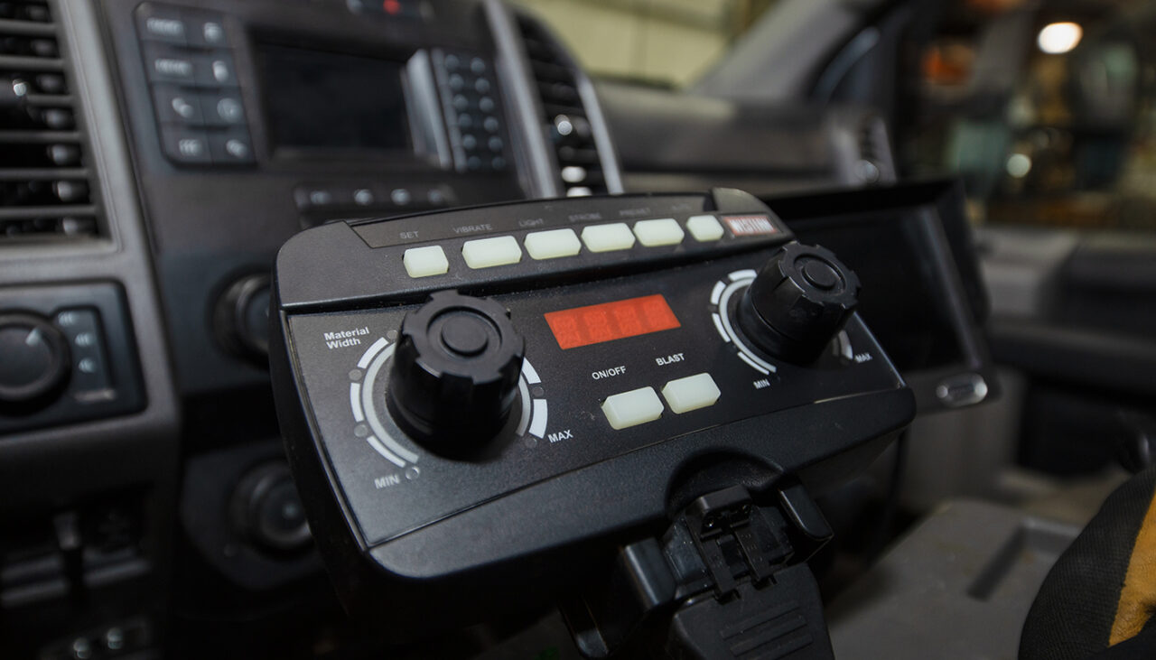 auto speed control in cab for hopper spreaders